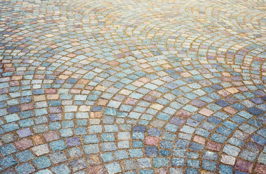 Multi coloured tiles are layed out in a foundation mosaic.